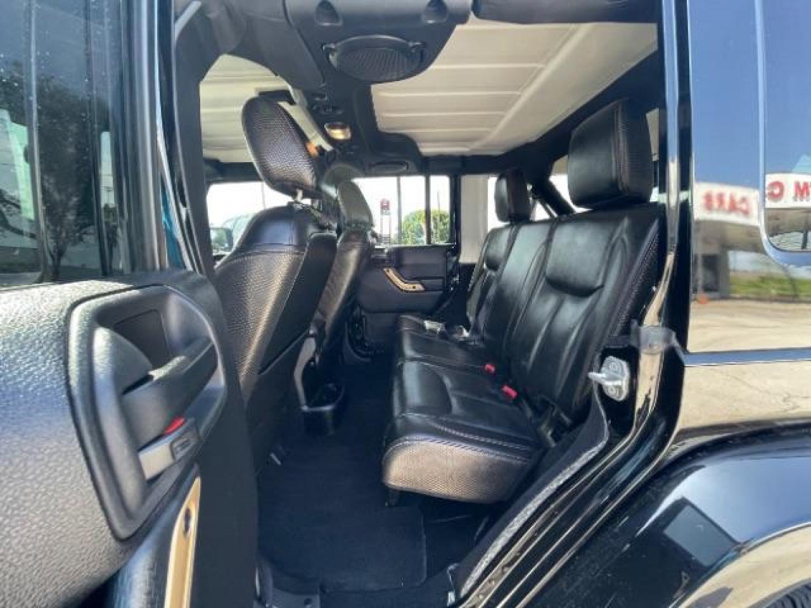 2014 Black Clearcoat Jeep Wrangler Unlimited Sahara 4WD (1C4BJWEG9EL) with an 3.6L V6 DOHC 24V FFV engine, located at 12182 Garland Rd, Dallas, TX, 75218, (214) 521-2040, 0.000000, 0.000000 - Photo #10