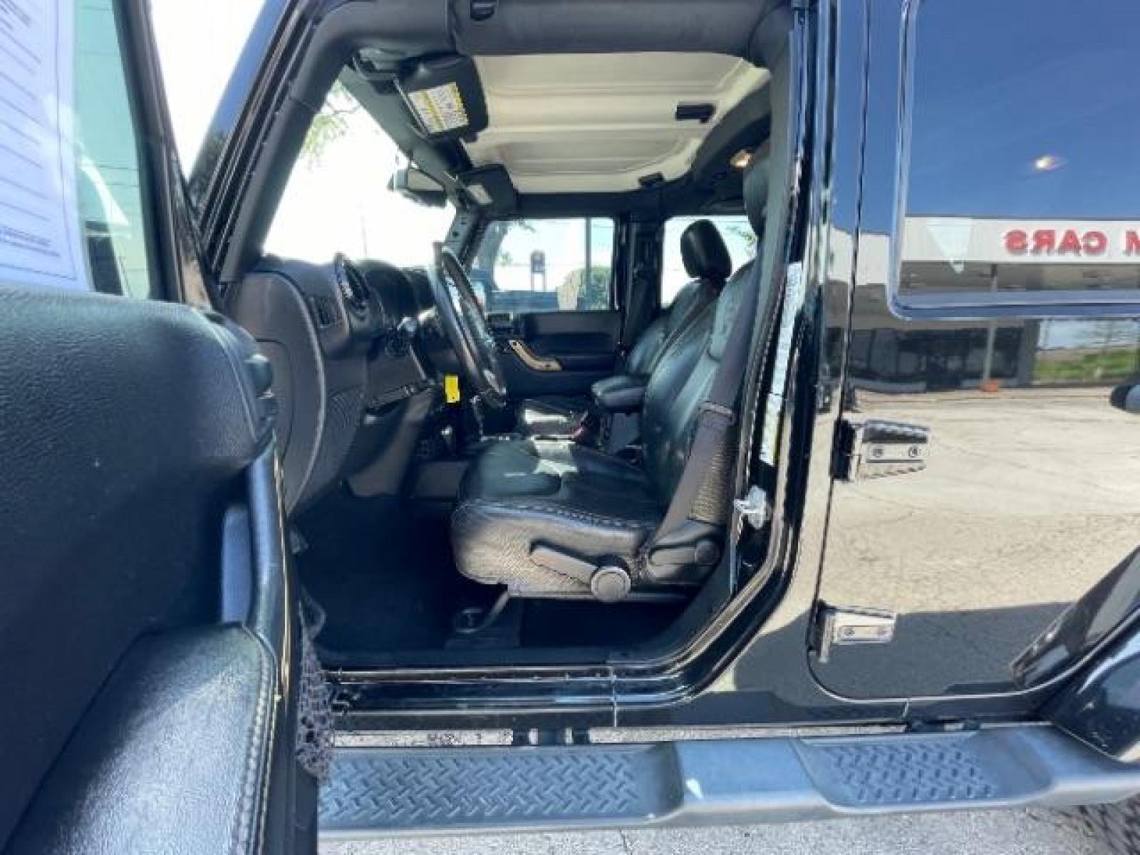 2014 Black Clearcoat Jeep Wrangler Unlimited Sahara 4WD (1C4BJWEG9EL) with an 3.6L V6 DOHC 24V FFV engine, located at 12182 Garland Rd, Dallas, TX, 75218, (214) 521-2040, 0.000000, 0.000000 - Photo #13
