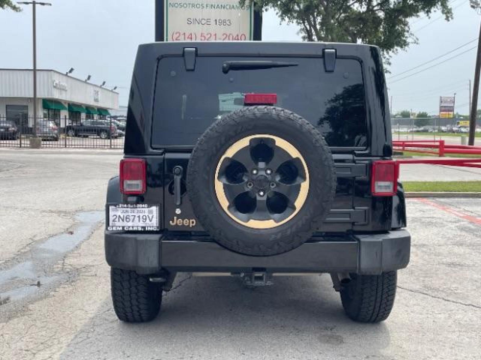2014 Black Clearcoat Jeep Wrangler Unlimited Sahara 4WD (1C4BJWEG9EL) with an 3.6L V6 DOHC 24V FFV engine, located at 12182 Garland Rd, Dallas, TX, 75218, (214) 521-2040, 0.000000, 0.000000 - Photo #4