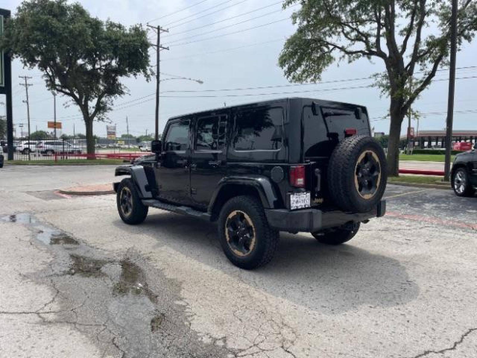2014 Black Clearcoat Jeep Wrangler Unlimited Sahara 4WD (1C4BJWEG9EL) with an 3.6L V6 DOHC 24V FFV engine, located at 12182 Garland Rd, Dallas, TX, 75218, (214) 521-2040, 0.000000, 0.000000 - Photo #5