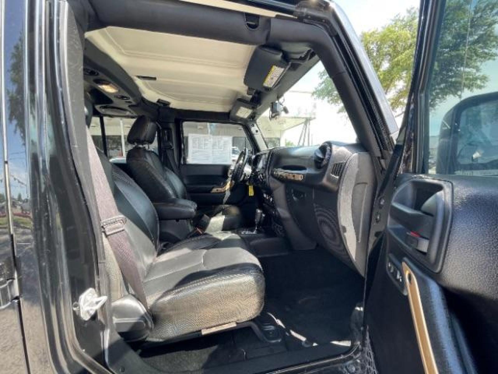 2014 Black Clearcoat Jeep Wrangler Unlimited Sahara 4WD (1C4BJWEG9EL) with an 3.6L V6 DOHC 24V FFV engine, located at 12182 Garland Rd, Dallas, TX, 75218, (214) 521-2040, 0.000000, 0.000000 - Photo #8
