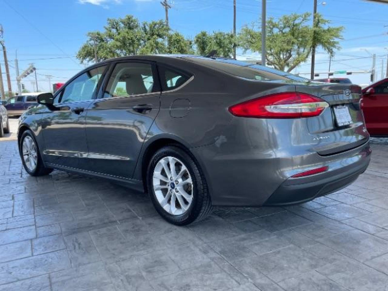2019 Magnetic Metallic /Ebony, cloth Ford Fusion SE (3FA6P0HD5KR) with an 1.5L L4 DOHC 16V engine, 6-Speed Automatic transmission, located at 12182 Garland Rd, Dallas, TX, 75218, (214) 521-2040, 0.000000, 0.000000 - Photo #5