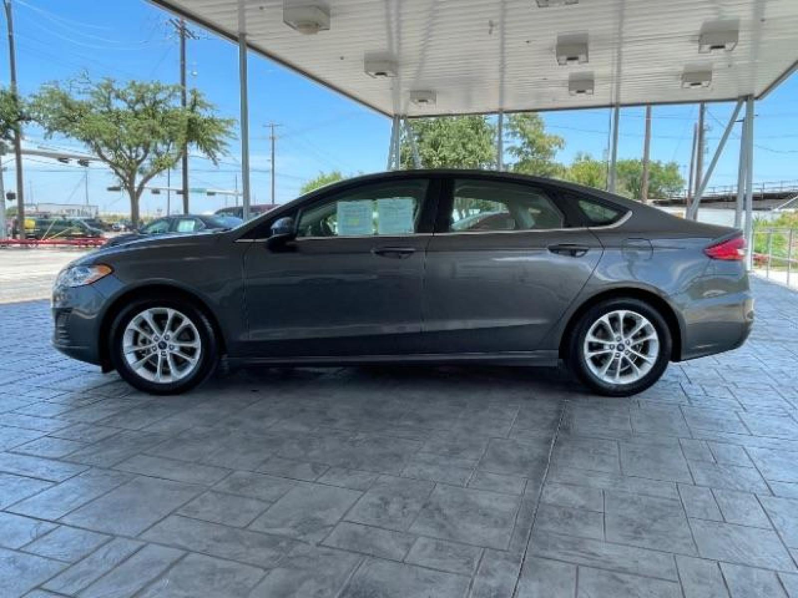 2019 Magnetic Metallic /Ebony, cloth Ford Fusion SE (3FA6P0HD5KR) with an 1.5L L4 DOHC 16V engine, 6-Speed Automatic transmission, located at 12182 Garland Rd, Dallas, TX, 75218, (214) 521-2040, 0.000000, 0.000000 - Photo #6