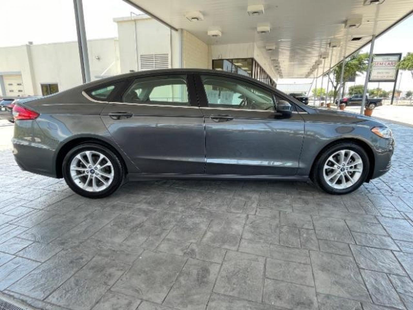 2019 Magnetic Metallic /Ebony, cloth Ford Fusion SE (3FA6P0HD5KR) with an 1.5L L4 DOHC 16V engine, 6-Speed Automatic transmission, located at 12182 Garland Rd, Dallas, TX, 75218, (214) 521-2040, 0.000000, 0.000000 - Photo #7