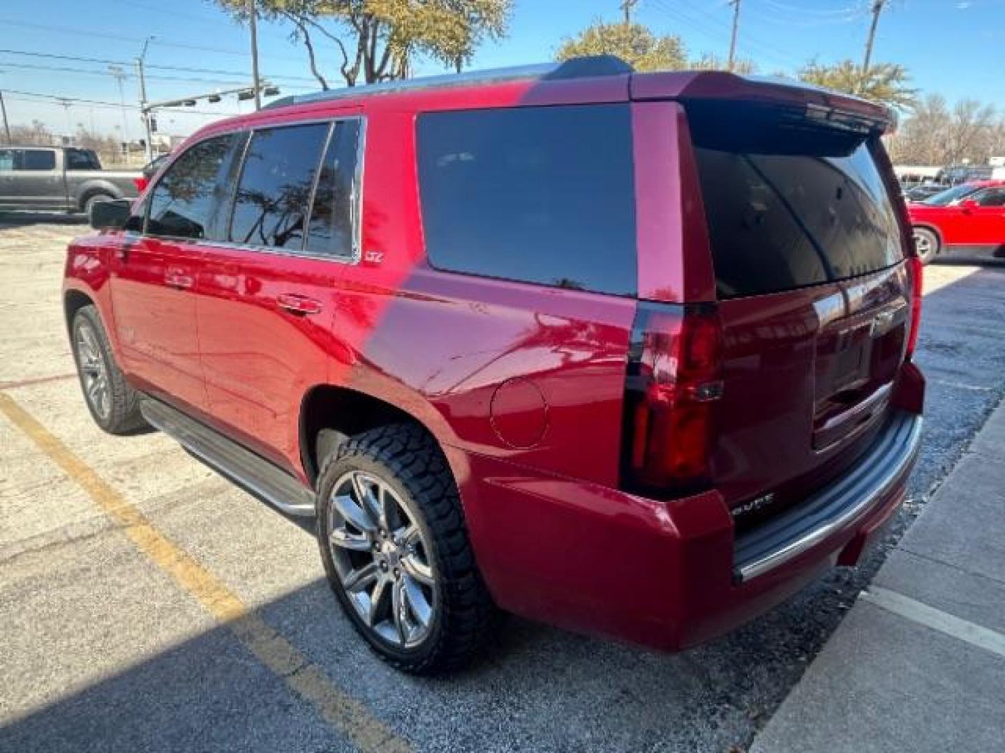 2015 Red Chevrolet Tahoe LTZ 2WD (1GNSCCKC7FR) with an 5.3L V8 OHV 16V engine, 6-Speed Automatic transmission, located at 12182 Garland Rd, Dallas, TX, 75218, (214) 521-2040, 0.000000, 0.000000 - Photo#4