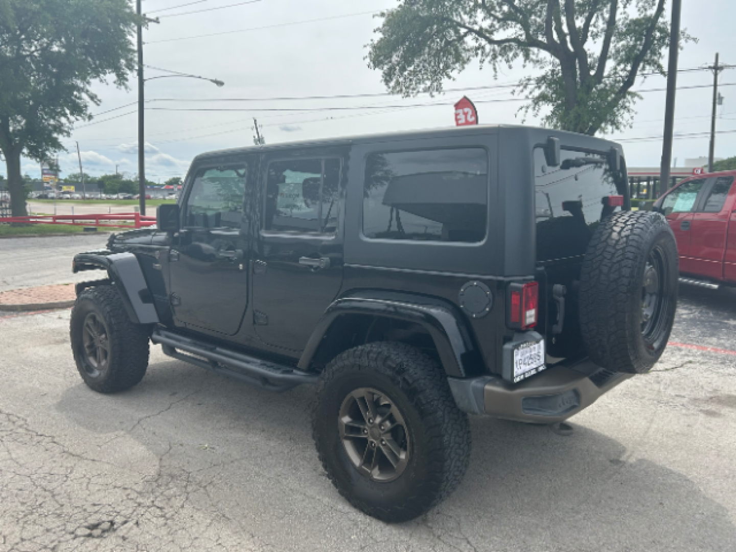 2017 Black Clear Coat Jeep Wrangler Unlimited Sahara 4WD (1C4BJWEG7HL) with an 3.6L V6 DOHC 24V FFV engine, located at 12182 Garland Rd, Dallas, TX, 75218, (214) 521-2040, 0.000000, 0.000000 - Photo#4