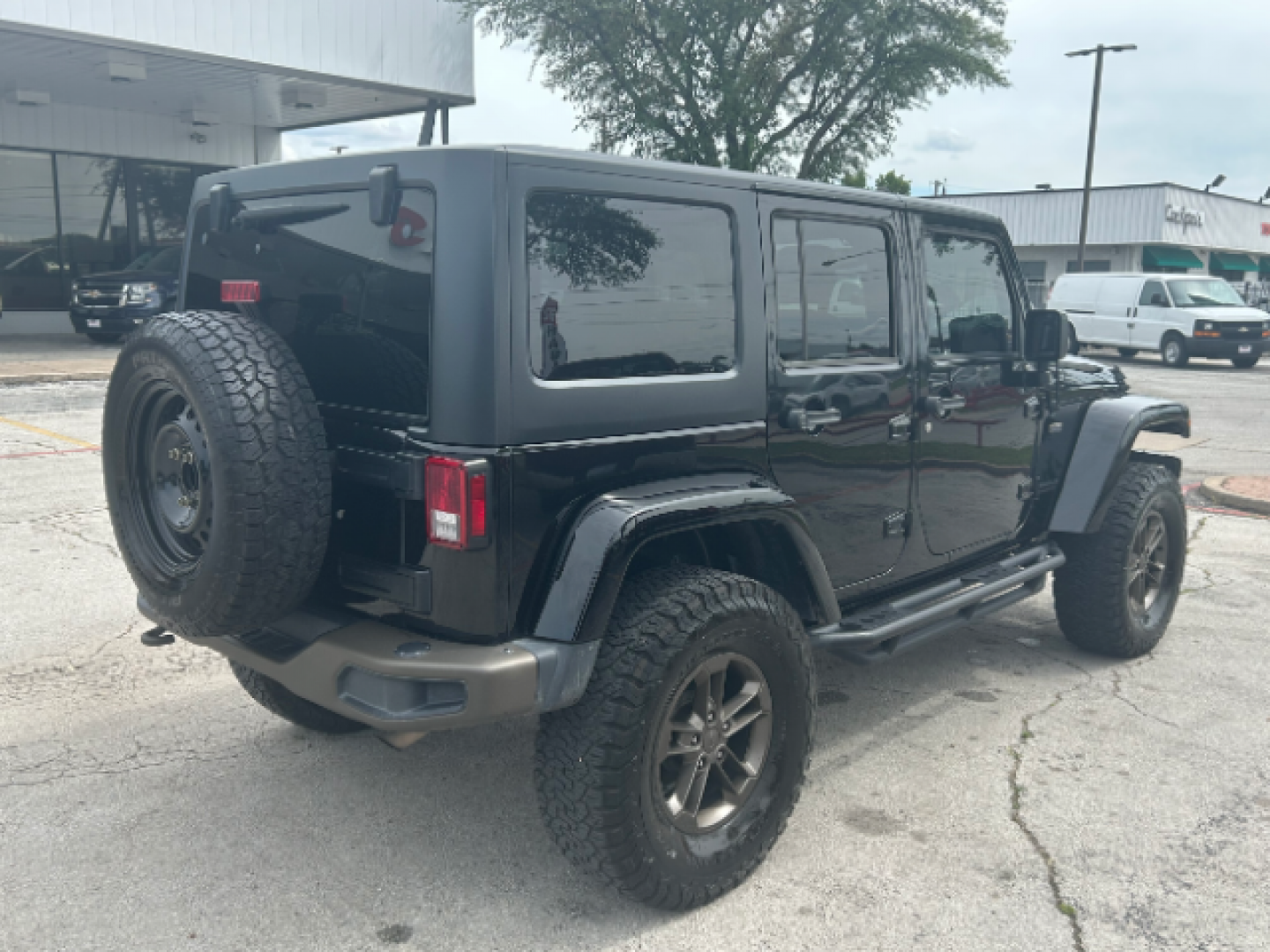 2017 Black Clear Coat Jeep Wrangler Unlimited Sahara 4WD (1C4BJWEG7HL) with an 3.6L V6 DOHC 24V FFV engine, located at 12182 Garland Rd, Dallas, TX, 75218, (214) 521-2040, 0.000000, 0.000000 - Photo#6