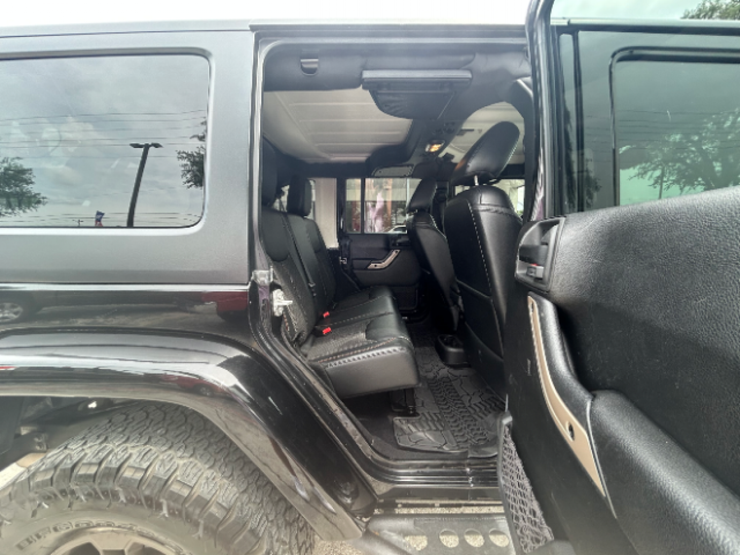 2017 Black Clear Coat Jeep Wrangler Unlimited Sahara 4WD (1C4BJWEG7HL) with an 3.6L V6 DOHC 24V FFV engine, located at 12182 Garland Rd, Dallas, TX, 75218, (214) 521-2040, 0.000000, 0.000000 - Photo#10