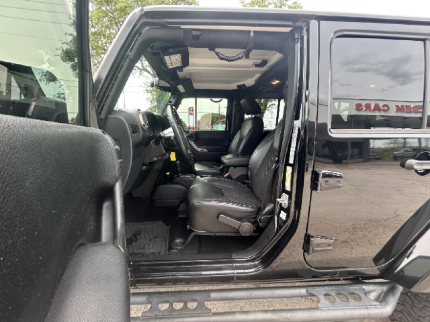 2017 Black Clear Coat Jeep Wrangler Unlimited Sahara 4WD (1C4BJWEG7HL) with an 3.6L V6 DOHC 24V FFV engine, located at 12182 Garland Rd, Dallas, TX, 75218, (214) 521-2040, 0.000000, 0.000000 - Photo#13
