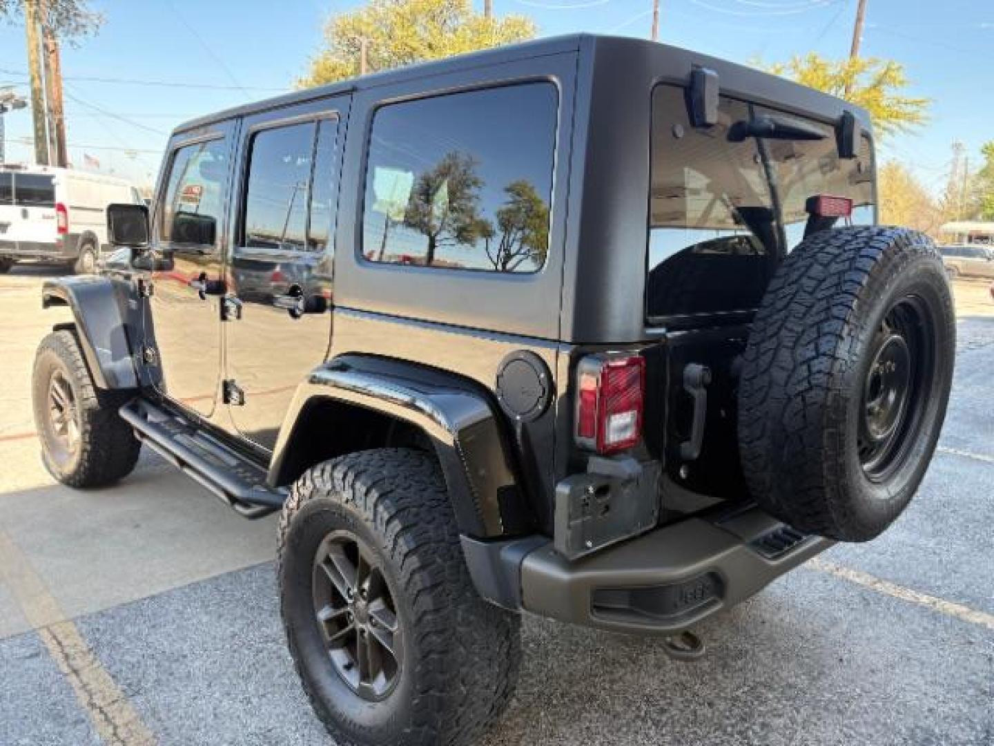 2017 Black Clear Coat /Black, leather Jeep Wrangler Unlimited Sahara 4WD (1C4BJWEG7HL) with an 3.6L V6 DOHC 24V FFV engine, 5-Speed Automatic transmission, located at 12182 Garland Rd, Dallas, TX, 75218, (214) 521-2040, 0.000000, 0.000000 - Photo#2