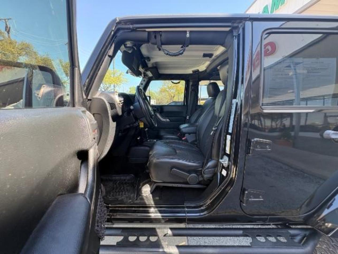 2017 Black Clear Coat /Black, leather Jeep Wrangler Unlimited Sahara 4WD (1C4BJWEG7HL) with an 3.6L V6 DOHC 24V FFV engine, 5-Speed Automatic transmission, located at 12182 Garland Rd, Dallas, TX, 75218, (214) 521-2040, 0.000000, 0.000000 - Photo#12