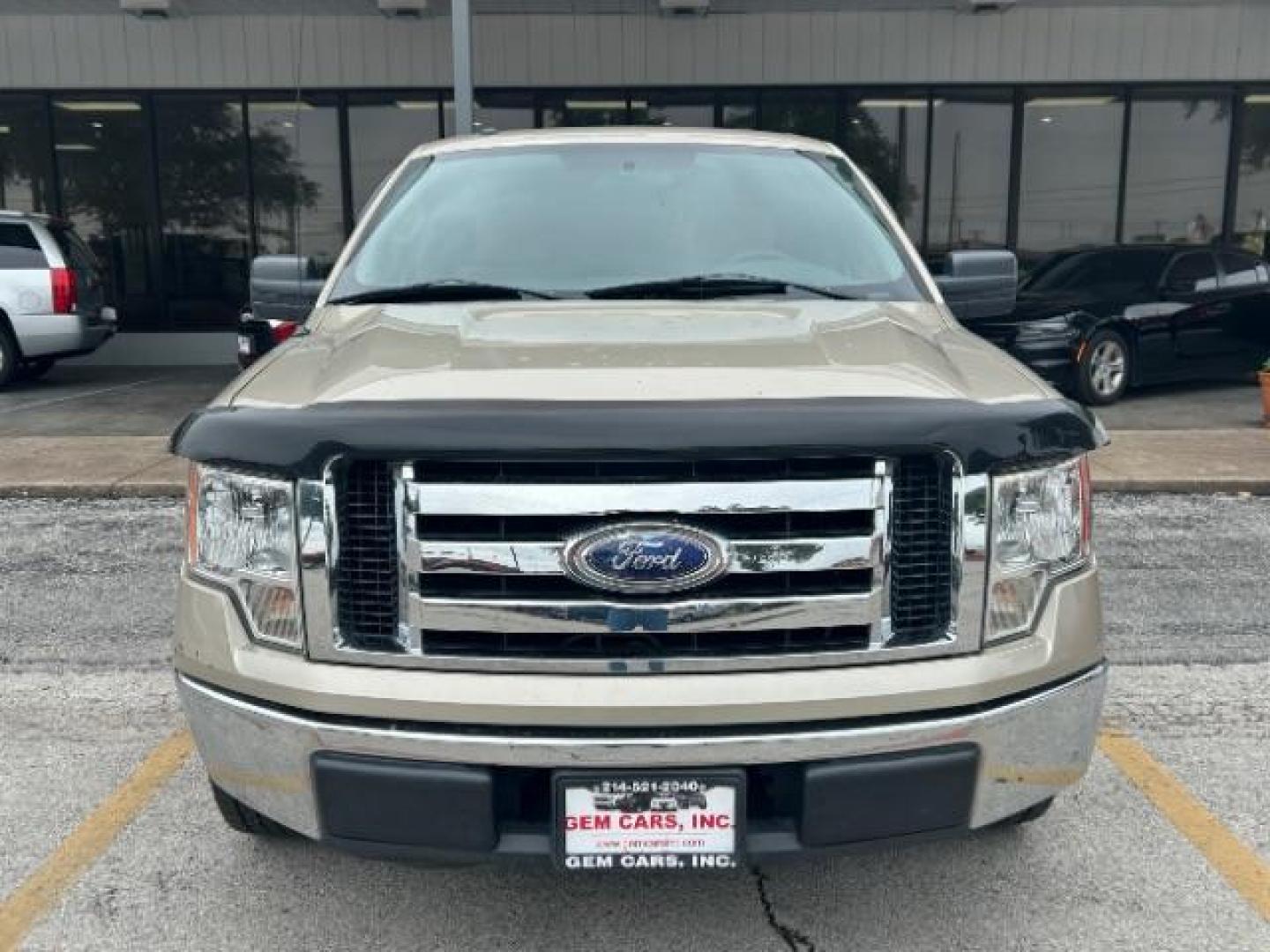 2009 Pueblo Gold Metallic /EBONY ACTIVEX SEAT MATERIAL Ford F-150 XLT SuperCrew 5.5-ft (1FTRW12879F) with an 4.6L V8 engine, Automatic transmission, located at 12182 Garland Rd, Dallas, TX, 75218, (214) 521-2040, 0.000000, 0.000000 - Photo#1