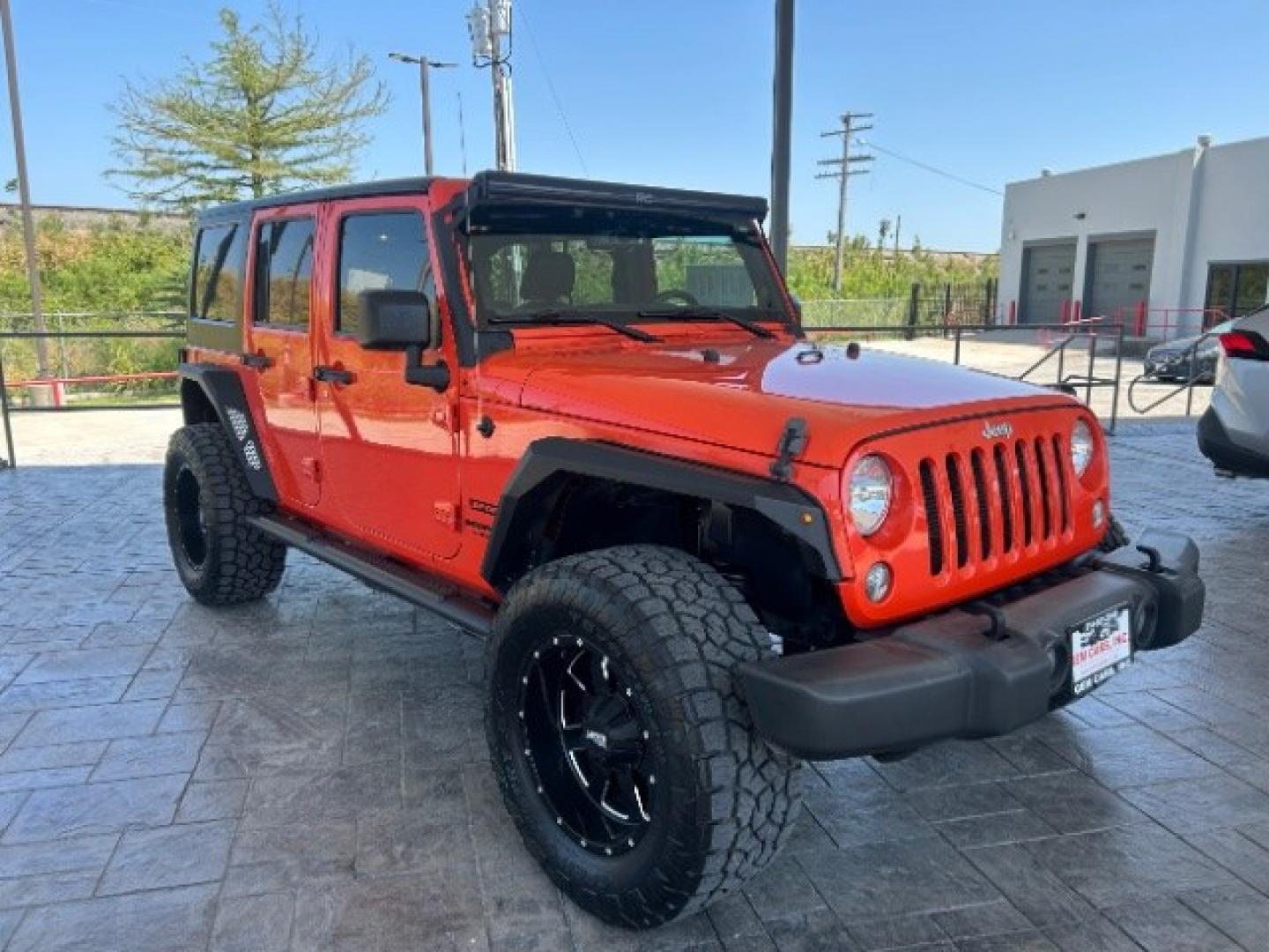 2015 Orange /Black Leather Interior Jeep Wrangler Unlimited Sport 4WD (1C4BJWDG4FL) with an 3.6L V6 DOHC 24V FFV engine, 5-Speed Automatic transmission, located at 12182 Garland Rd, Dallas, TX, 75218, (214) 521-2040, 0.000000, 0.000000- Photo#0