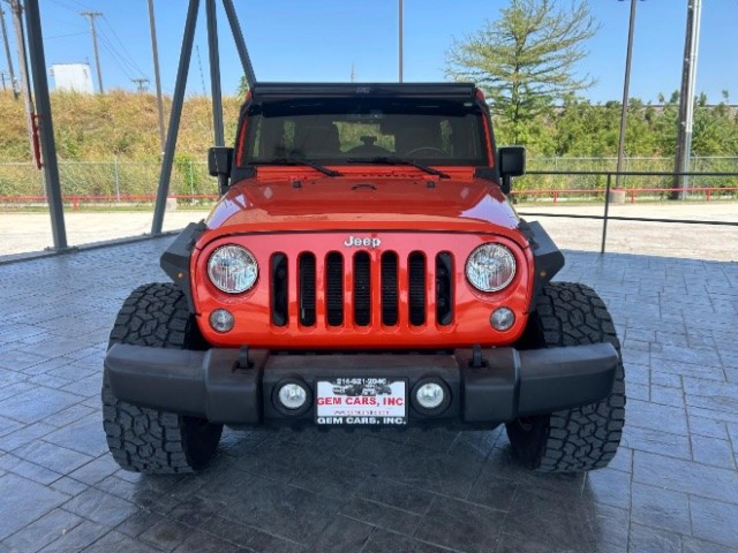 2015 Orange /Black Leather Interior Jeep Wrangler Unlimited Sport 4WD (1C4BJWDG4FL) with an 3.6L V6 DOHC 24V FFV engine, 5-Speed Automatic transmission, located at 12182 Garland Rd, Dallas, TX, 75218, (214) 521-2040, 0.000000, 0.000000- Photo#1