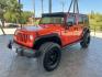 2015 Orange /Black Leather Interior Jeep Wrangler Unlimited Sport 4WD (1C4BJWDG4FL) with an 3.6L V6 DOHC 24V FFV engine, 5-Speed Automatic transmission, located at 12182 Garland Rd, Dallas, TX, 75218, (214) 521-2040, 0.000000, 0.000000- Photo#2