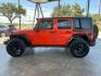2015 Orange /Black Leather Interior Jeep Wrangler Unlimited Sport 4WD (1C4BJWDG4FL) with an 3.6L V6 DOHC 24V FFV engine, 5-Speed Automatic transmission, located at 12182 Garland Rd, Dallas, TX, 75218, (214) 521-2040, 0.000000, 0.000000- Photo#3