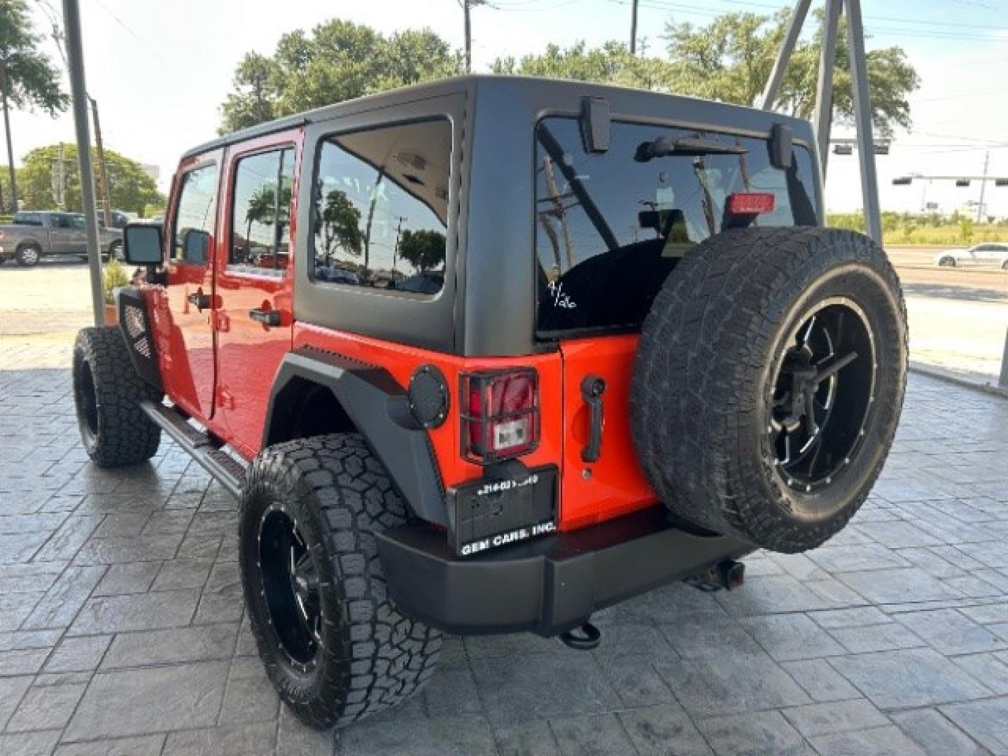 2015 Orange /Black Leather Interior Jeep Wrangler Unlimited Sport 4WD (1C4BJWDG4FL) with an 3.6L V6 DOHC 24V FFV engine, 5-Speed Automatic transmission, located at 12182 Garland Rd, Dallas, TX, 75218, (214) 521-2040, 0.000000, 0.000000- Photo#4