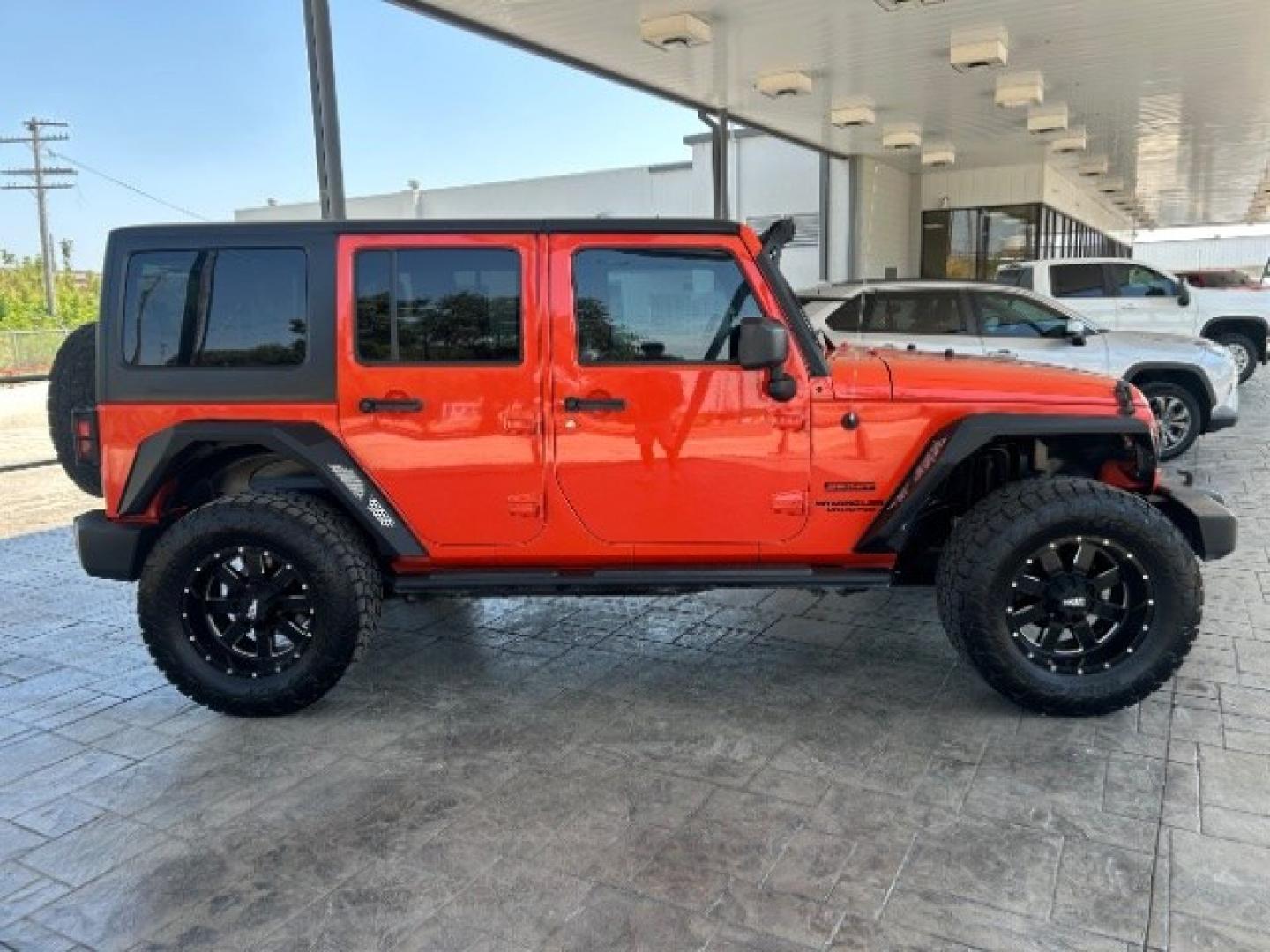 2015 Orange /Black Leather Interior Jeep Wrangler Unlimited Sport 4WD (1C4BJWDG4FL) with an 3.6L V6 DOHC 24V FFV engine, 5-Speed Automatic transmission, located at 12182 Garland Rd, Dallas, TX, 75218, (214) 521-2040, 0.000000, 0.000000- Photo#8