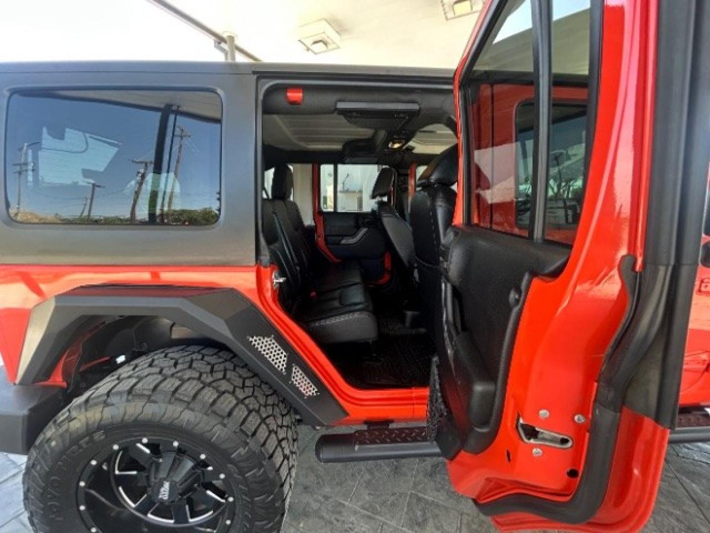 2015 Orange /Black Leather Interior Jeep Wrangler Unlimited Sport 4WD (1C4BJWDG4FL) with an 3.6L V6 DOHC 24V FFV engine, 5-Speed Automatic transmission, located at 12182 Garland Rd, Dallas, TX, 75218, (214) 521-2040, 0.000000, 0.000000- Photo#10