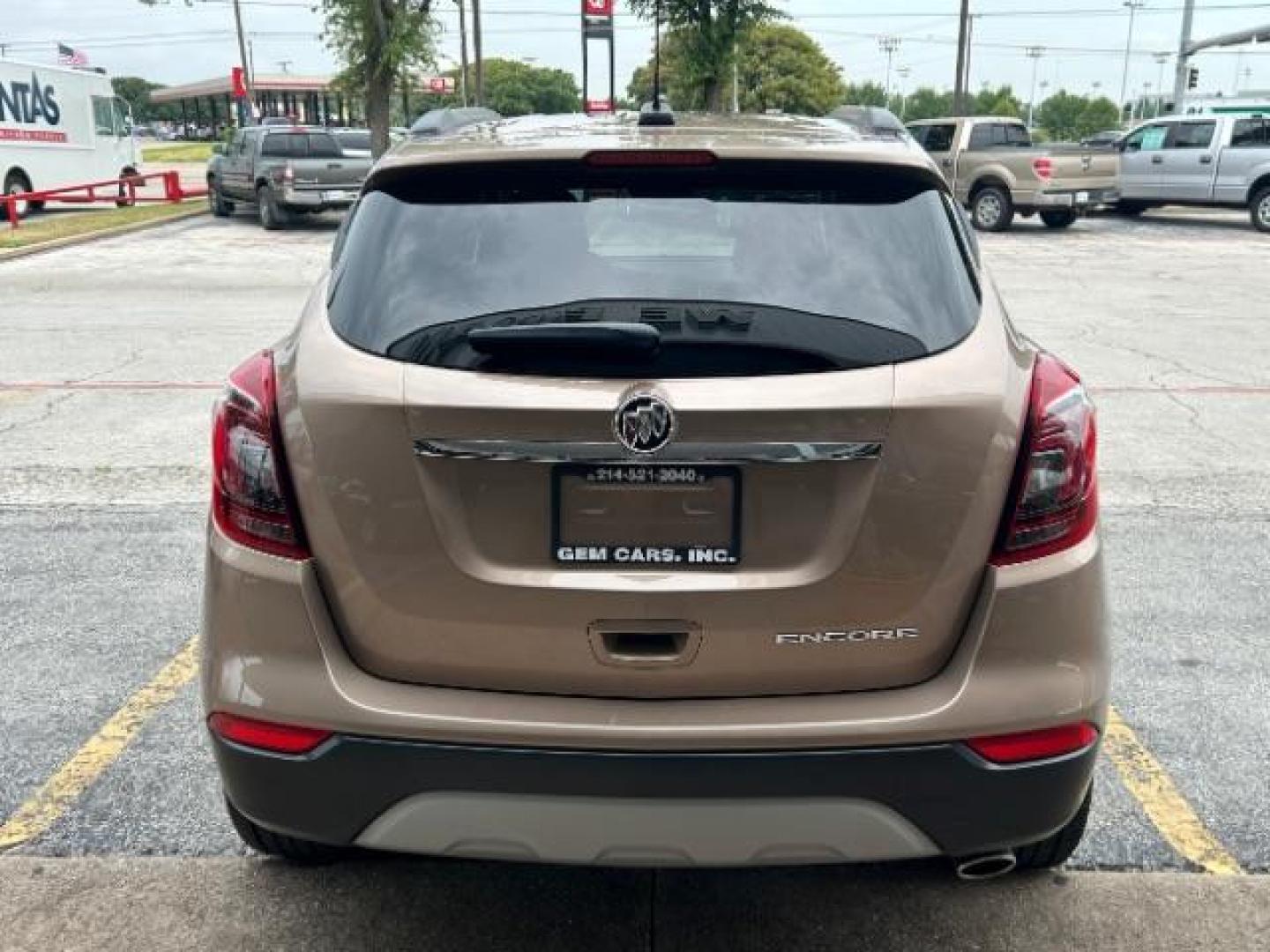 2019 Coppertino Metallic/Black Carbon Metallic /Ebony, leatherette/cloth Buick Encore Preferred FWD (KL4CJASBXKB) with an 1.4L L4 DOHC 16V TURBO engine, 6-Speed Automatic transmission, located at 12182 Garland Rd, Dallas, TX, 75218, (214) 521-2040, 0.000000, 0.000000 - Photo#5