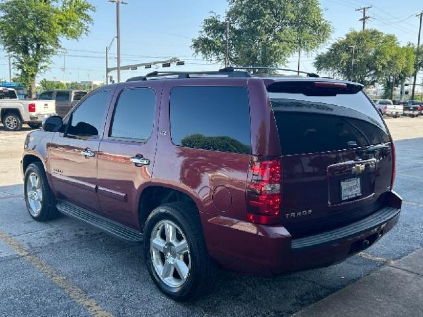 2008 Deep Ruby Metallic /Ebony Chevrolet Tahoe LTZ (1GNFC13068R) with an Vortec 5.3L V-8 regular unleaded engine, Automatic transmission, located at 12182 Garland Rd, Dallas, TX, 75218, (214) 521-2040, 0.000000, 0.000000 - Photo#4