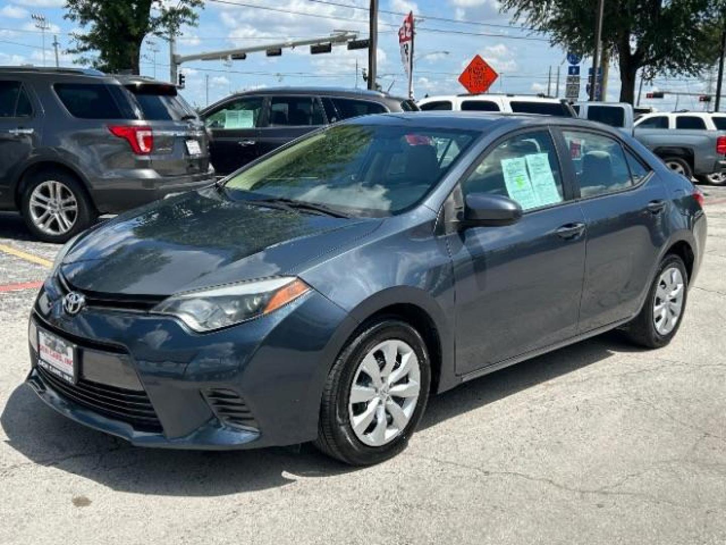 2015 Slate Metallic Toyota Corolla LE (5YFBURHE6FP) with an 1.8L I-4 DOHC engine, located at 12182 Garland Rd, Dallas, TX, 75218, (214) 521-2040, 0.000000, 0.000000 - Photo#2