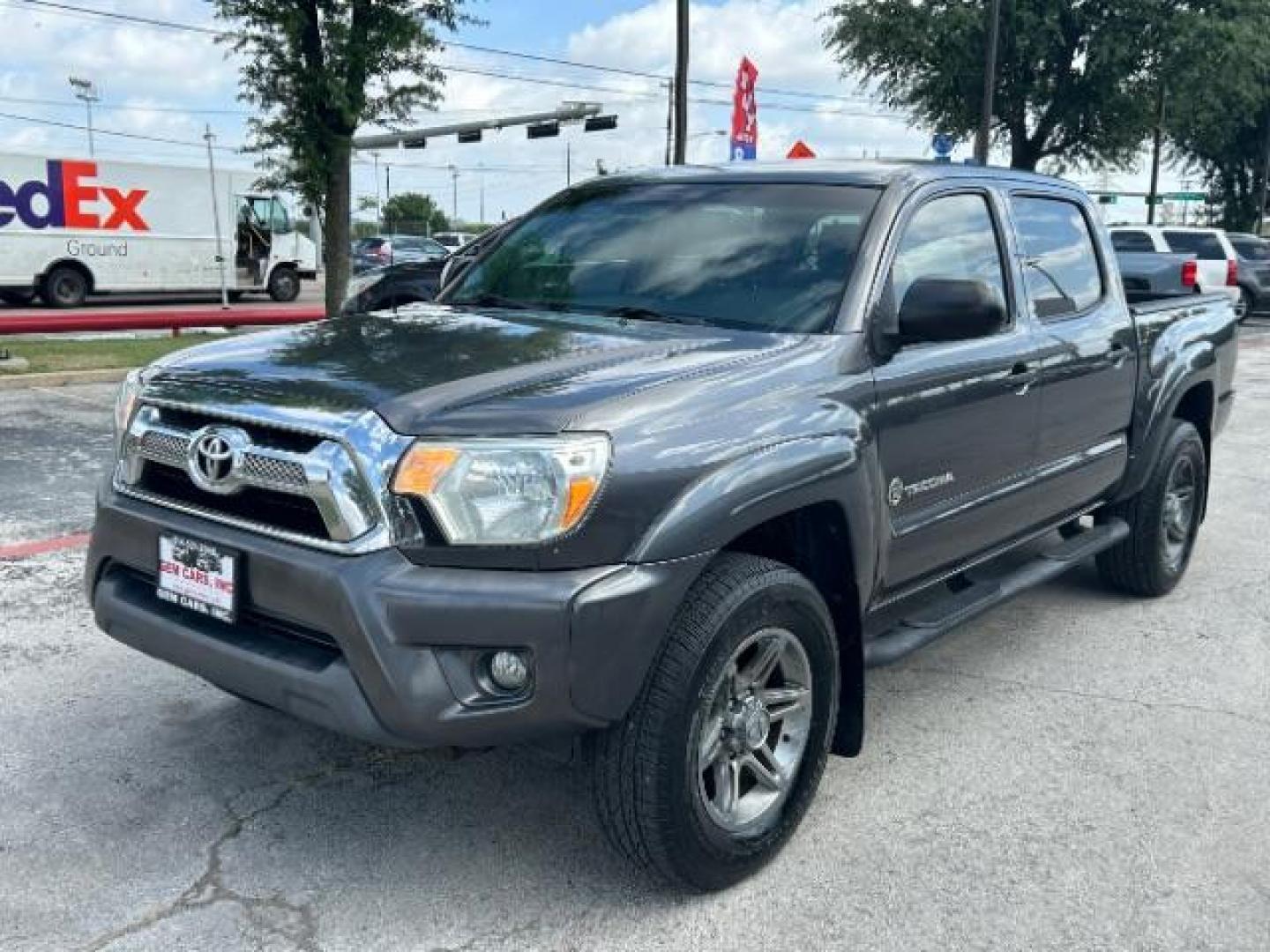 2012 Black Toyota Tacoma PreRunner V6 (5TFJU4GN4CX) with an 4L V-6 DOHC engine, located at 12182 Garland Rd, Dallas, TX, 75218, (214) 521-2040, 0.000000, 0.000000 - Photo#2