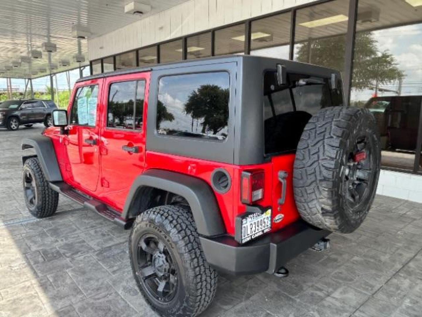 2015 Firecracker Red Clear Coat Jeep Wrangler Unlimited Sport 4WD (1C4HJWDG1FL) with an 3.6L V6 DOHC 24V FFV engine, located at 12182 Garland Rd, Dallas, TX, 75218, (214) 521-2040, 0.000000, 0.000000 - Photo#4