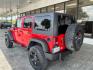 2015 Firecracker Red Clear Coat Jeep Wrangler Unlimited Sport 4WD (1C4HJWDG1FL) with an 3.6L V6 DOHC 24V FFV engine, located at 12182 Garland Rd, Dallas, TX, 75218, (214) 521-2040, 0.000000, 0.000000 - Photo#4