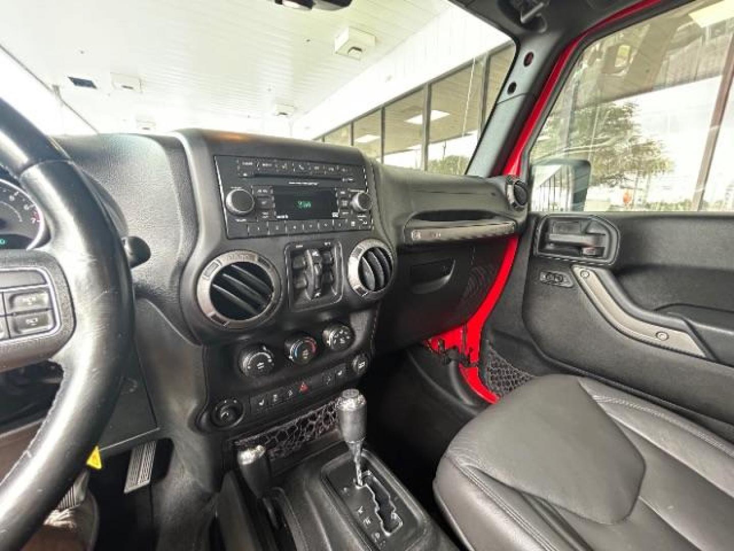 2015 Firecracker Red Clear Coat Jeep Wrangler Unlimited Sport 4WD (1C4HJWDG1FL) with an 3.6L V6 DOHC 24V FFV engine, located at 12182 Garland Rd, Dallas, TX, 75218, (214) 521-2040, 0.000000, 0.000000 - Photo#15
