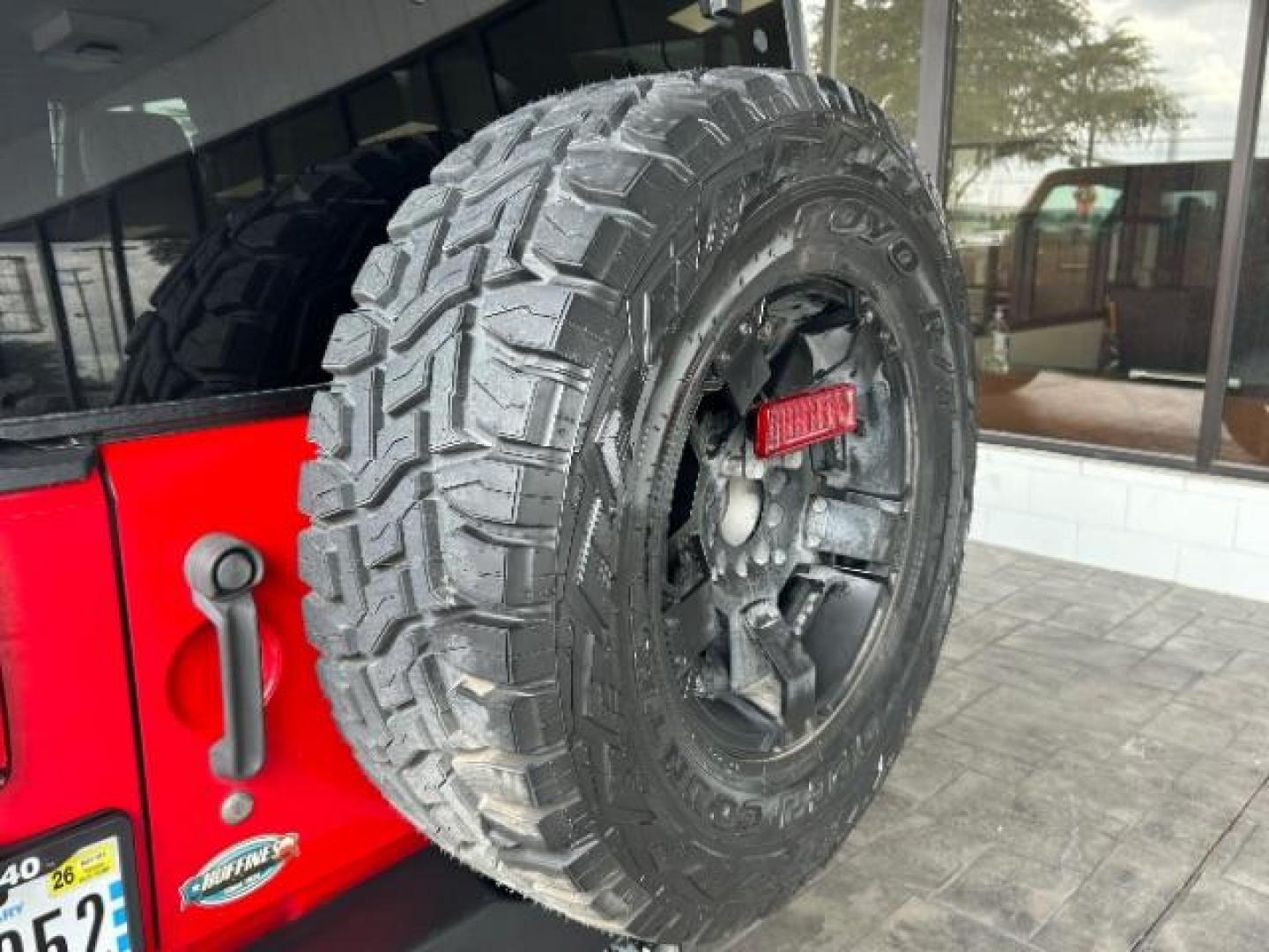 2015 Firecracker Red Clear Coat Jeep Wrangler Unlimited Sport 4WD (1C4HJWDG1FL) with an 3.6L V6 DOHC 24V FFV engine, located at 12182 Garland Rd, Dallas, TX, 75218, (214) 521-2040, 0.000000, 0.000000 - Photo#17
