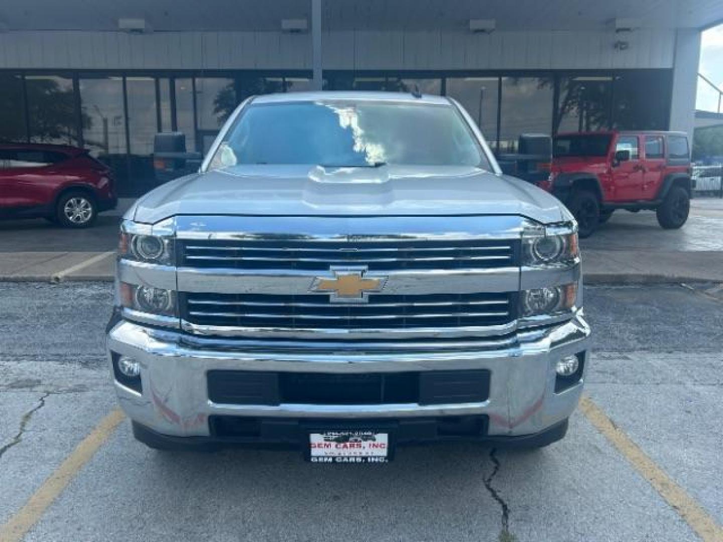 2017 Silver Ice Metallic Chevrolet Silverado 2500HD LT (1GC1KVEG8HF) with an Vortec 6L V-8 variable valve control engine, located at 12182 Garland Rd, Dallas, TX, 75218, (214) 521-2040, 0.000000, 0.000000 - Photo#1