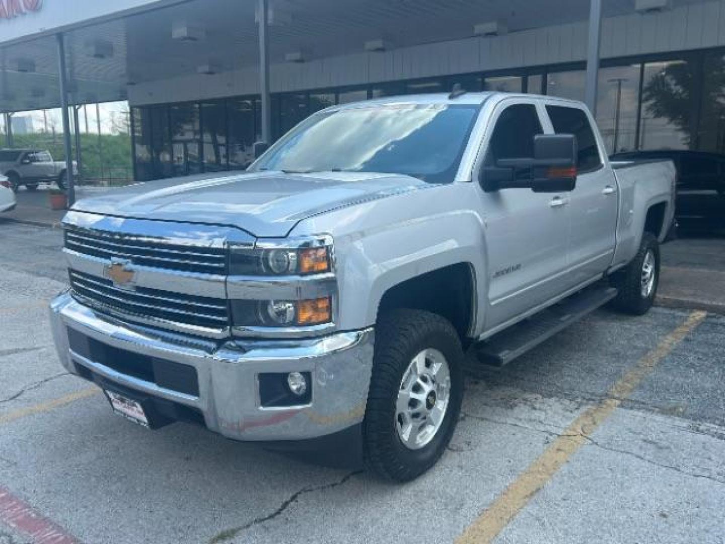 2017 Silver Ice Metallic Chevrolet Silverado 2500HD LT (1GC1KVEG8HF) with an Vortec 6L V-8 variable valve control engine, located at 12182 Garland Rd, Dallas, TX, 75218, (214) 521-2040, 0.000000, 0.000000 - Photo#2