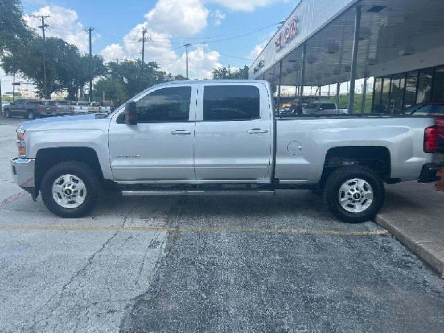 2017 Silver Ice Metallic Chevrolet Silverado 2500HD LT (1GC1KVEG8HF) with an Vortec 6L V-8 variable valve control engine, located at 12182 Garland Rd, Dallas, TX, 75218, (214) 521-2040, 0.000000, 0.000000 - Photo#3