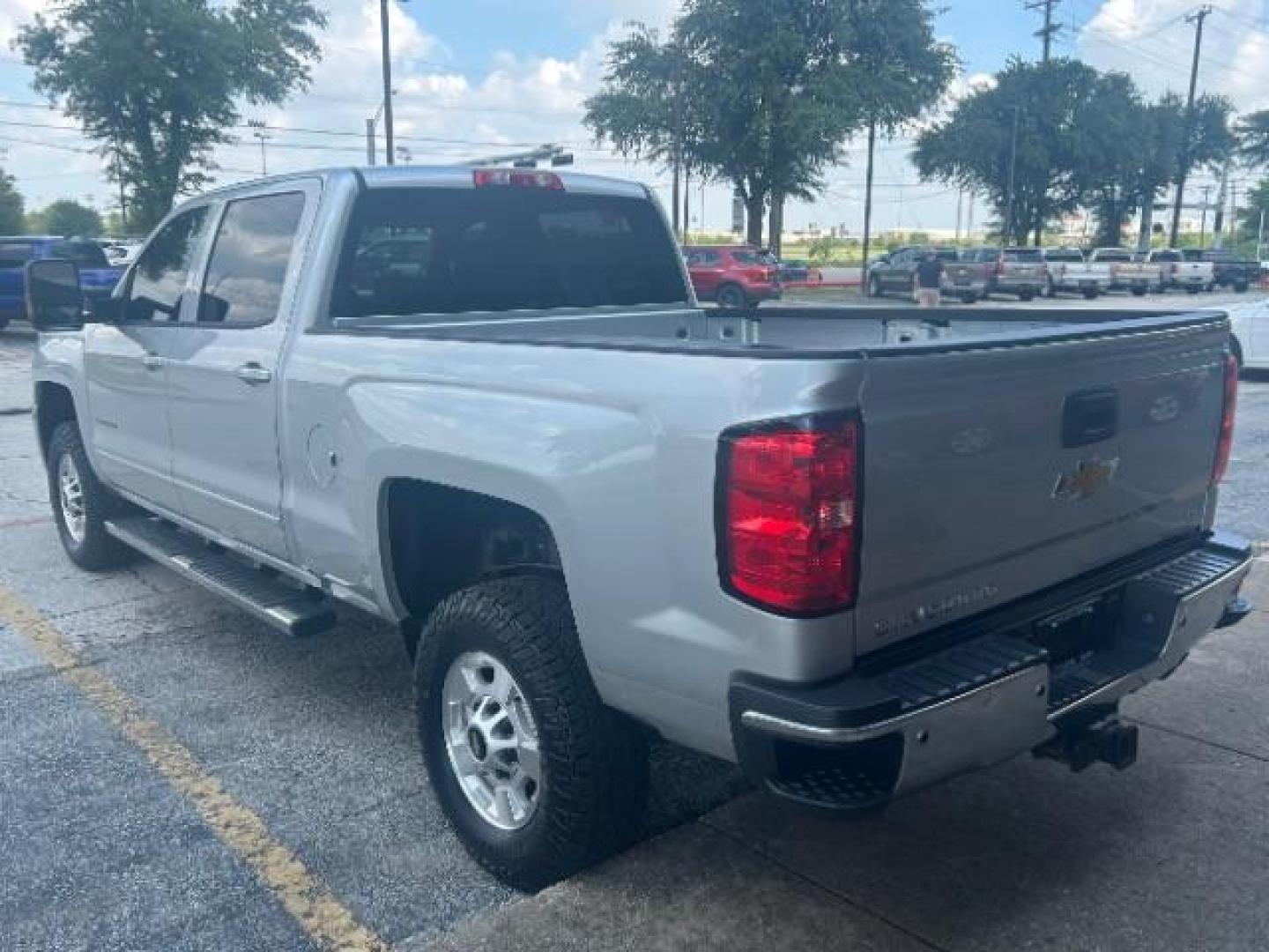 2017 Silver Ice Metallic Chevrolet Silverado 2500HD LT (1GC1KVEG8HF) with an Vortec 6L V-8 variable valve control engine, located at 12182 Garland Rd, Dallas, TX, 75218, (214) 521-2040, 0.000000, 0.000000 - Photo#4