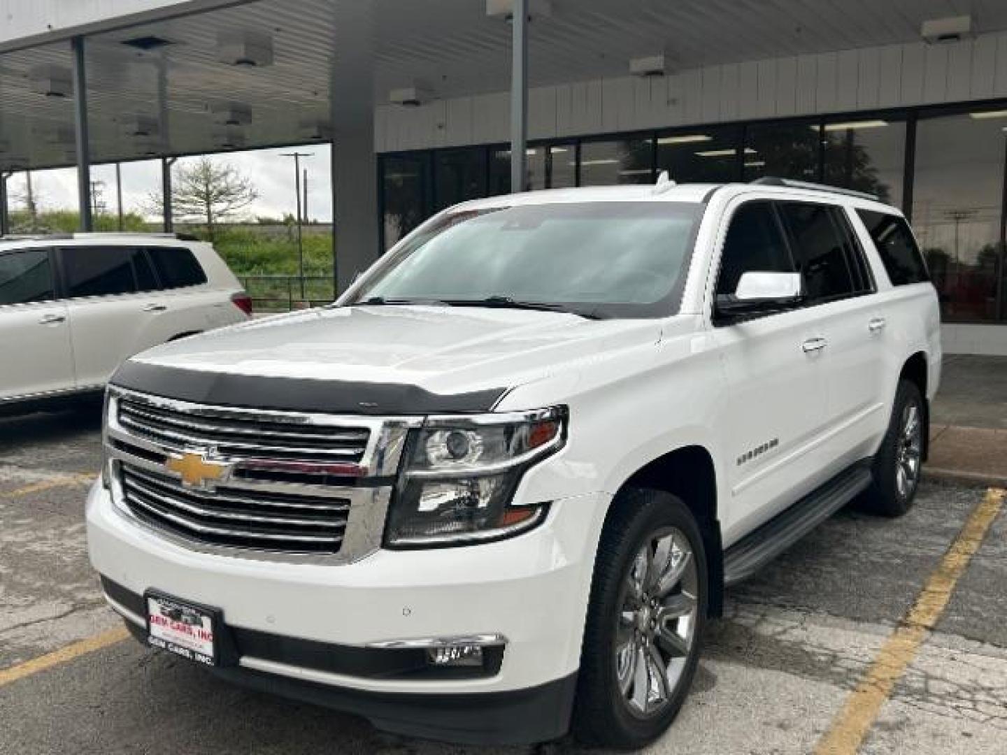 2016 Summit White Chevrolet Suburban LTZ (1GNSCJKC1GR) with an EcoTec3 5.3L V-8 gasoline direct injection engine, located at 12182 Garland Rd, Dallas, TX, 75218, (214) 521-2040, 0.000000, 0.000000 - Photo#2