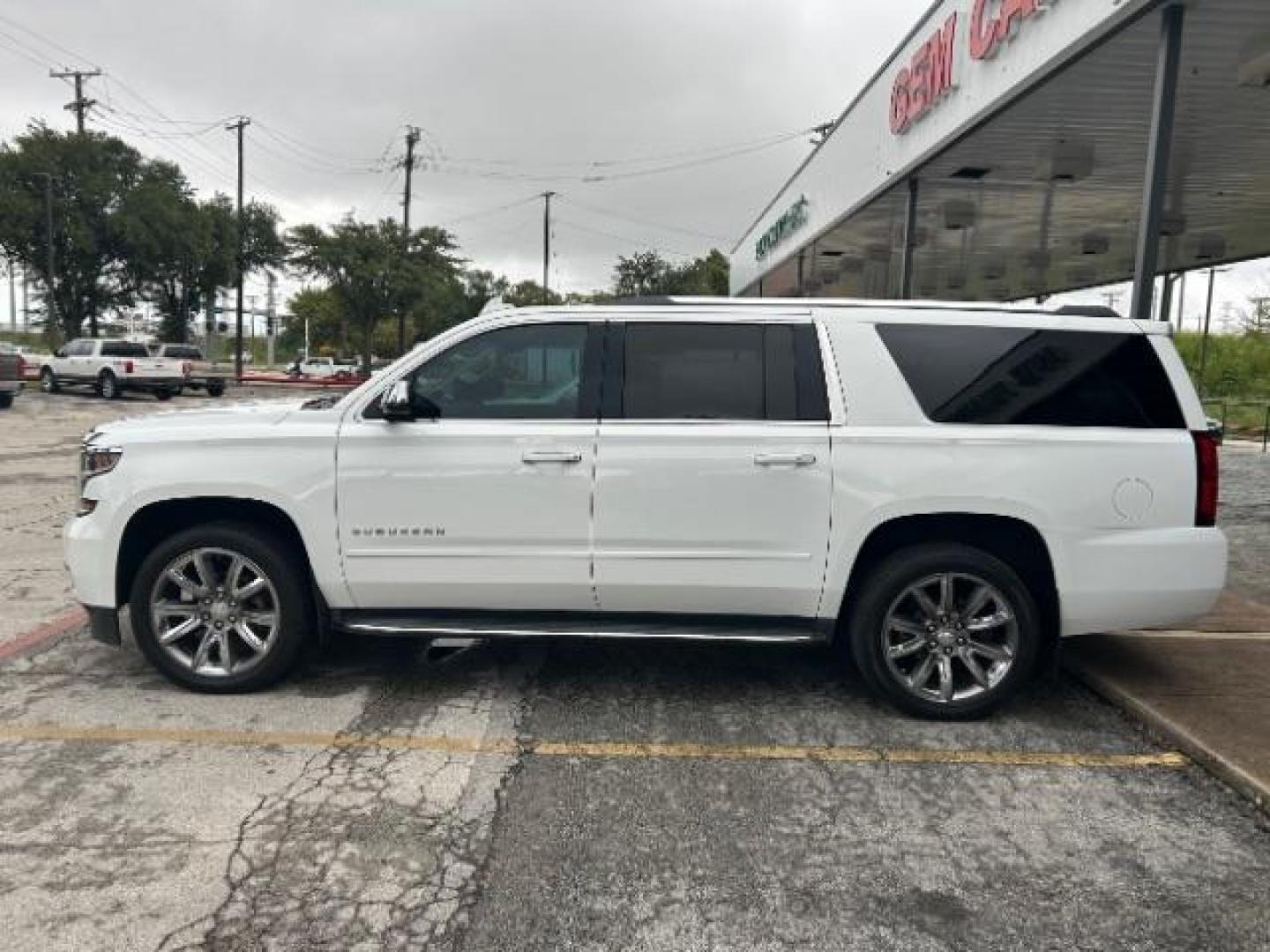 2016 Summit White Chevrolet Suburban LTZ (1GNSCJKC1GR) with an EcoTec3 5.3L V-8 gasoline direct injection engine, located at 12182 Garland Rd, Dallas, TX, 75218, (214) 521-2040, 0.000000, 0.000000 - Photo#3