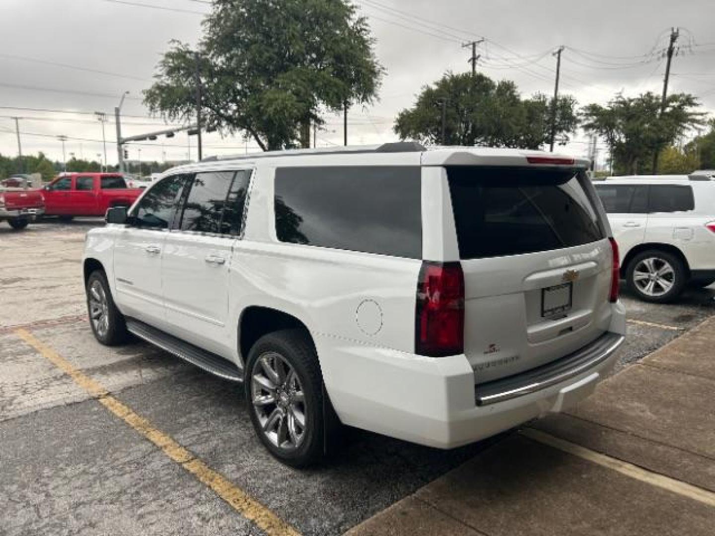 2016 Summit White Chevrolet Suburban LTZ (1GNSCJKC1GR) with an EcoTec3 5.3L V-8 gasoline direct injection engine, located at 12182 Garland Rd, Dallas, TX, 75218, (214) 521-2040, 0.000000, 0.000000 - Photo#4