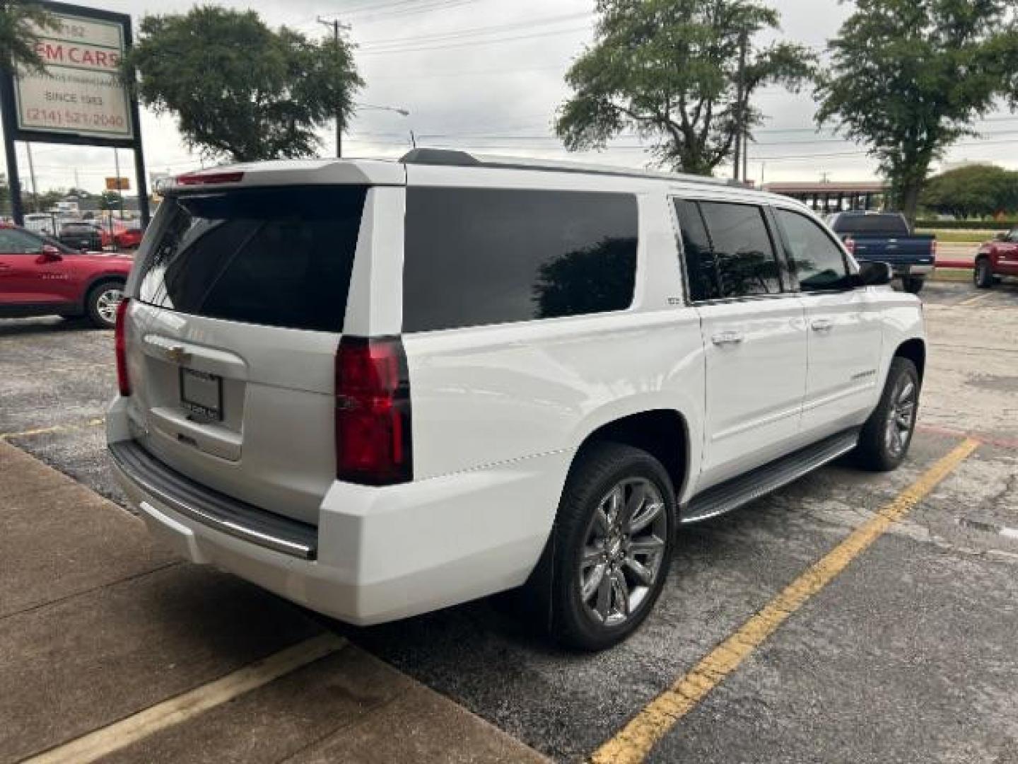 2016 Summit White Chevrolet Suburban LTZ (1GNSCJKC1GR) with an EcoTec3 5.3L V-8 gasoline direct injection engine, located at 12182 Garland Rd, Dallas, TX, 75218, (214) 521-2040, 0.000000, 0.000000 - Photo#6