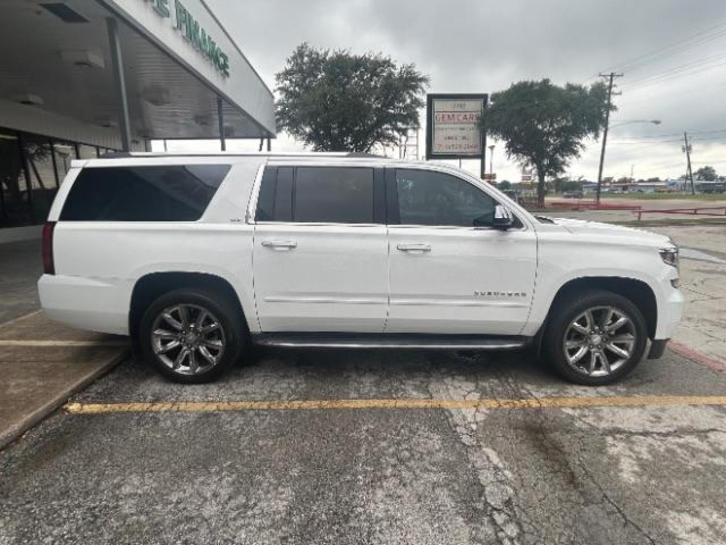 2016 Summit White Chevrolet Suburban LTZ (1GNSCJKC1GR) with an EcoTec3 5.3L V-8 gasoline direct injection engine, located at 12182 Garland Rd, Dallas, TX, 75218, (214) 521-2040, 0.000000, 0.000000 - Photo#7