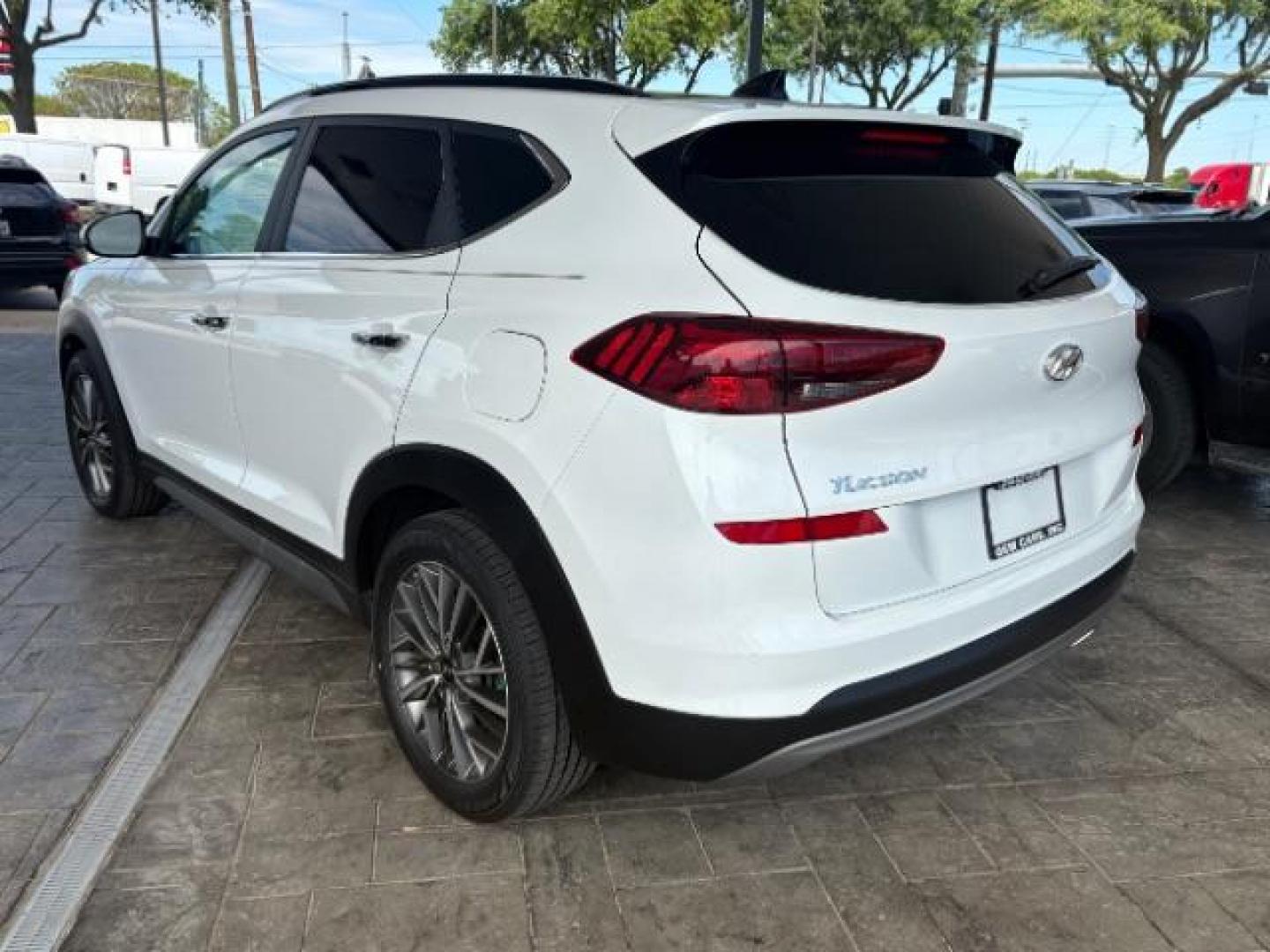 2021 Winter White Hyundai Tucson Ultimate (KM8J33AL2MU) with an Theta 2.4L I-4 gasoline direct injection engine, located at 12182 Garland Rd, Dallas, TX, 75218, (214) 521-2040, 0.000000, 0.000000 - Photo#2