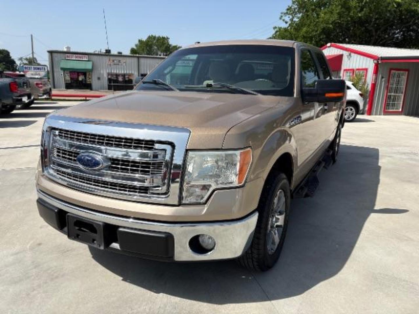 2014 Pale Adobe Metallic Ford F-150 XLT (1FTFW1CF1EK) with an 5.0L V8 engine, located at 12182 Garland Rd, Dallas, TX, 75218, (214) 521-2040, 0.000000, 0.000000- Photo#2