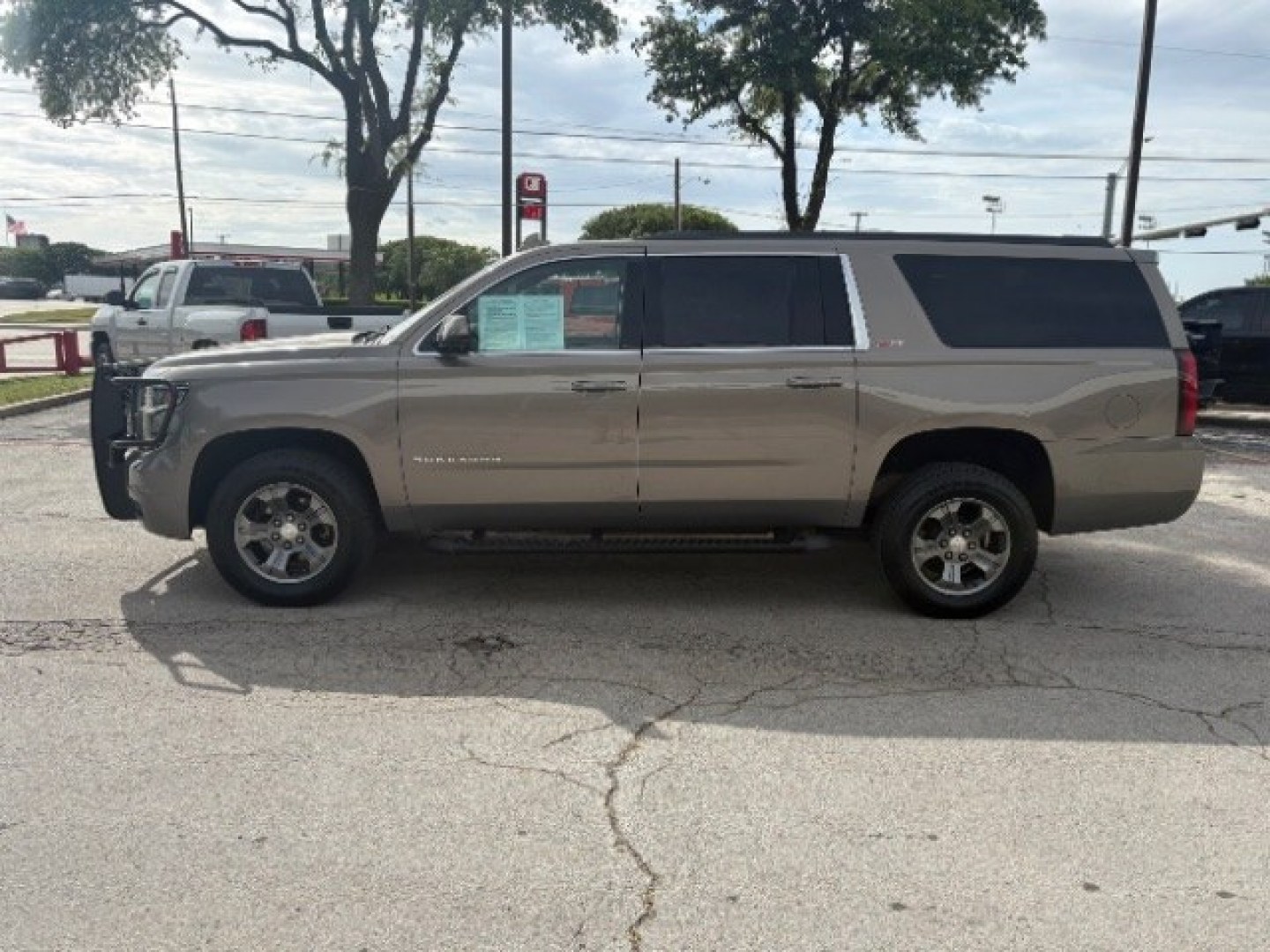 2019 Pepperdust Metallic Chevrolet Suburban LT (1GNSKHKC0KR) with an EcoTec3 5.3L V-8 gasoline direct injection engine, located at 12182 Garland Rd, Dallas, TX, 75218, (214) 521-2040, 0.000000, 0.000000- Photo#1